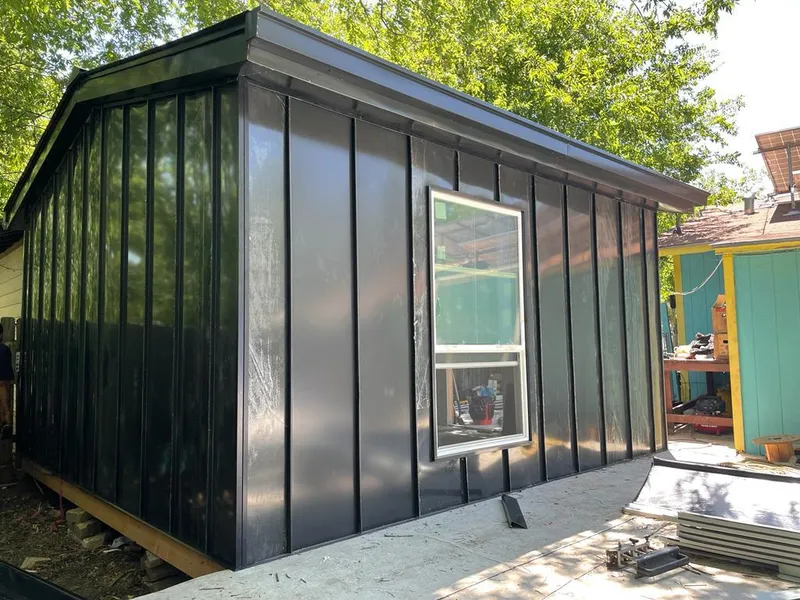 Black standing seam metal wall panels for Roof Inspection in LaGrange