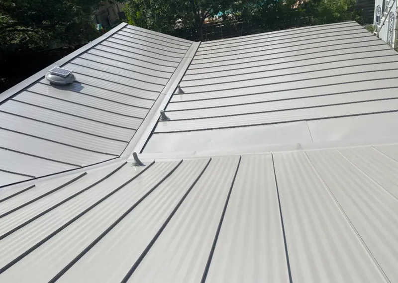 Solar attic fan installed on a metal roof for Roof Ventilation in LaGrange